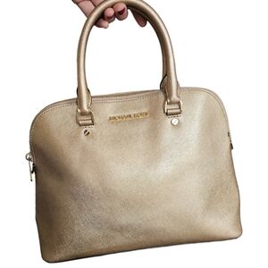 Michael Kors Gold Bag with removable shoulder crossbody strap.